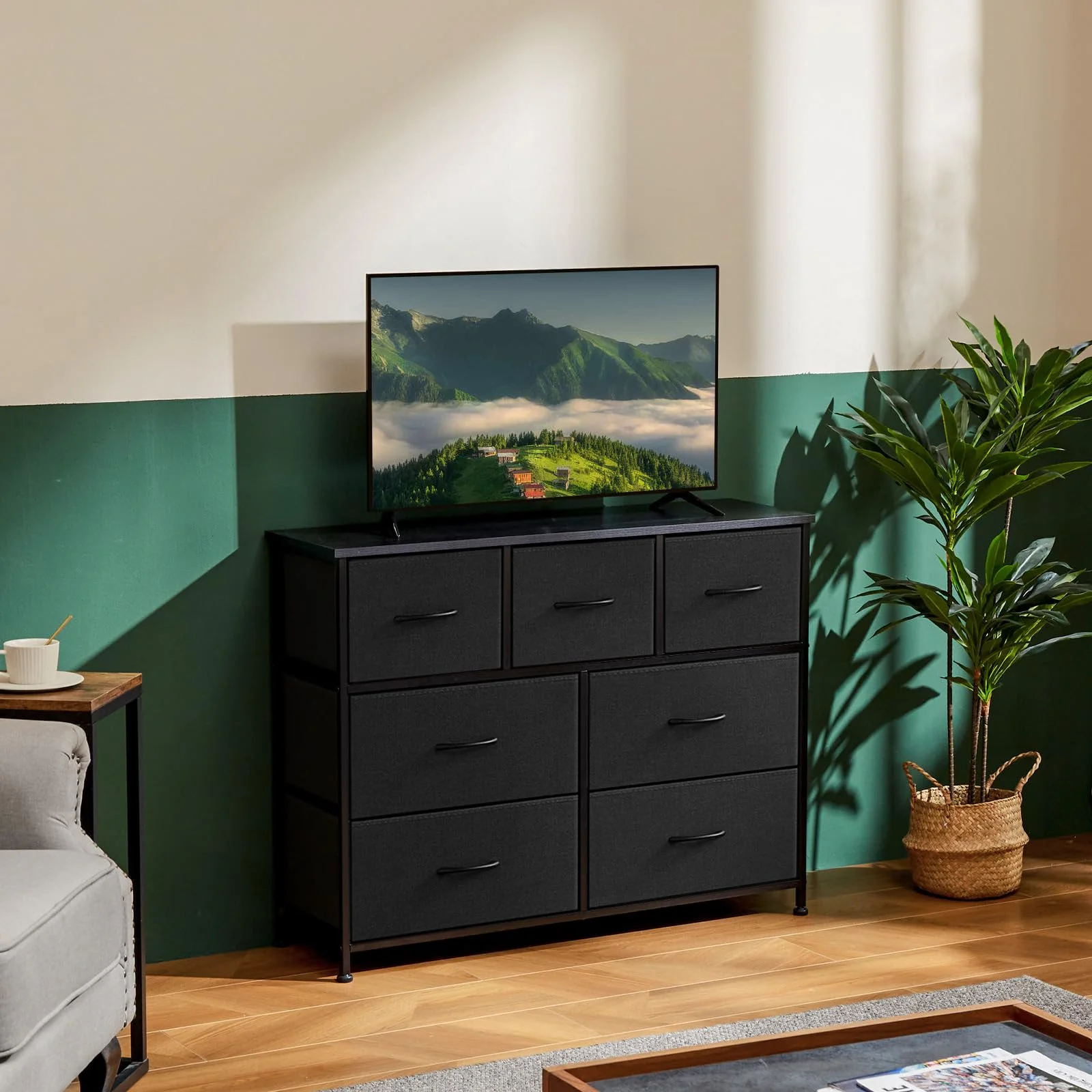 The 7-drawer dresser moonlighting as a media stand, drawers full either way